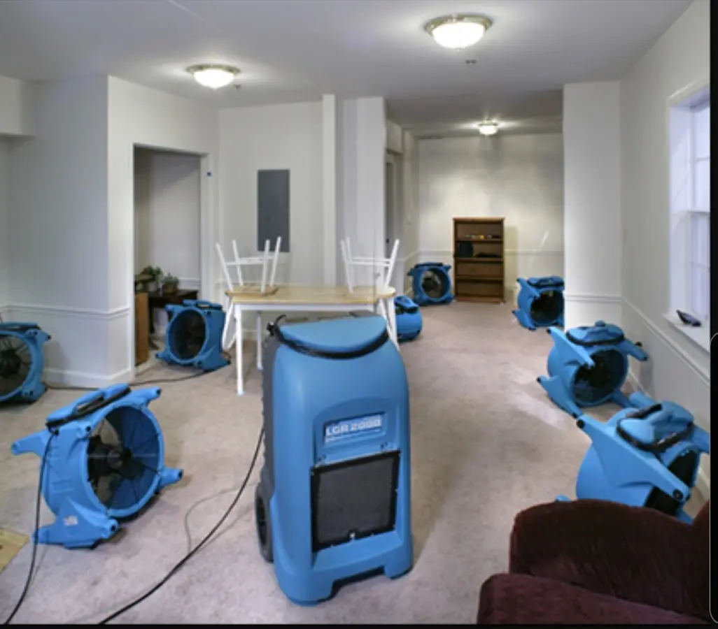 Air movers and dehumidifier setup for Water Damage Restoration in Raisin